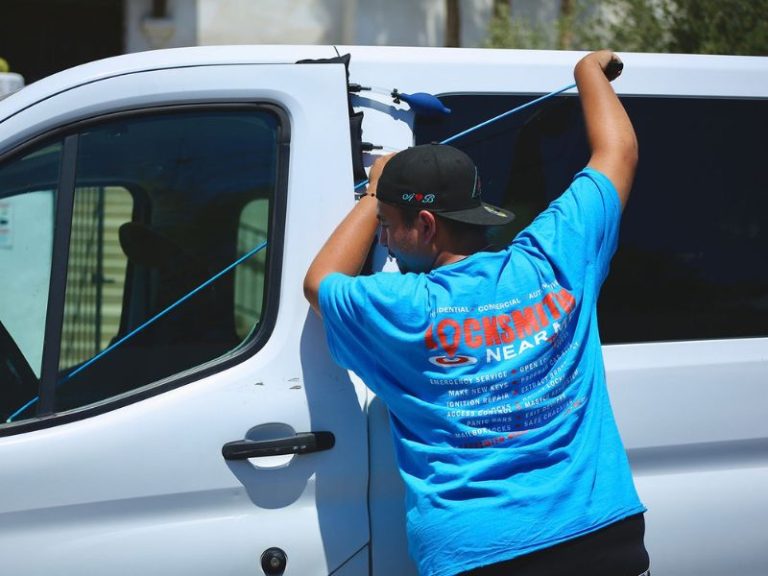 Locksmith opening a car door with an air wedge in Tucson, AZ